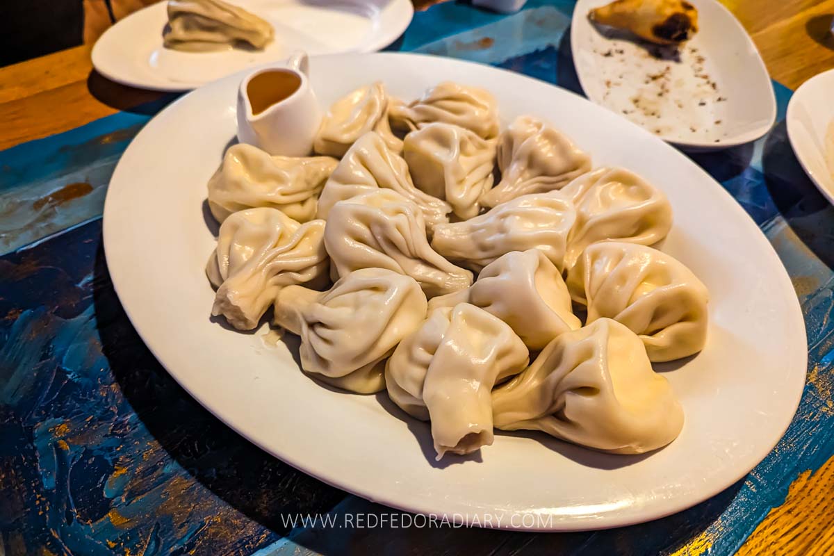 Where to Eat the Best Khinkali in Tbilisi - 2025 Local Guide 6 Plate of juicy khinkali in Tbilisi at Zodiaqo restaurant